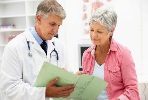 Woman with arthritis at medical consultation